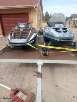 2 snowmobiles artic cat and polaris - (Elizabeth/Kiowa)